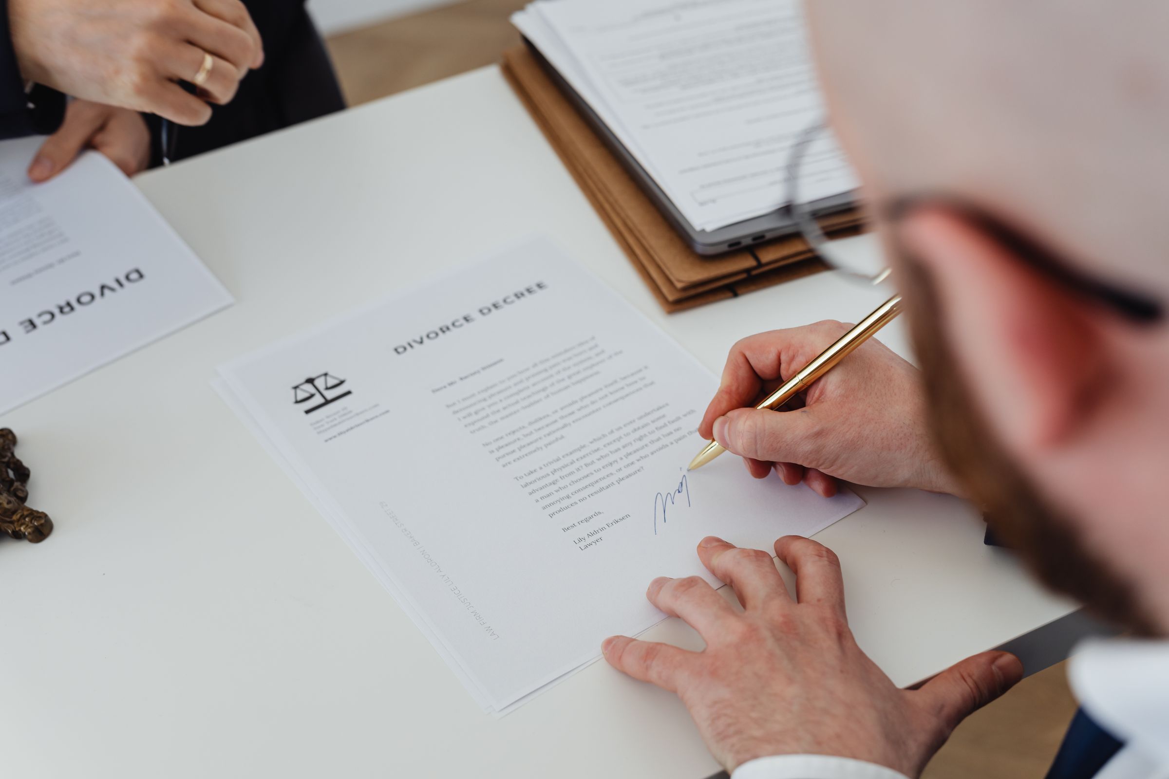 Patient signing an intake document